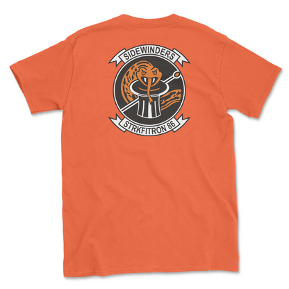 Orange t-shirt with squadron patch.